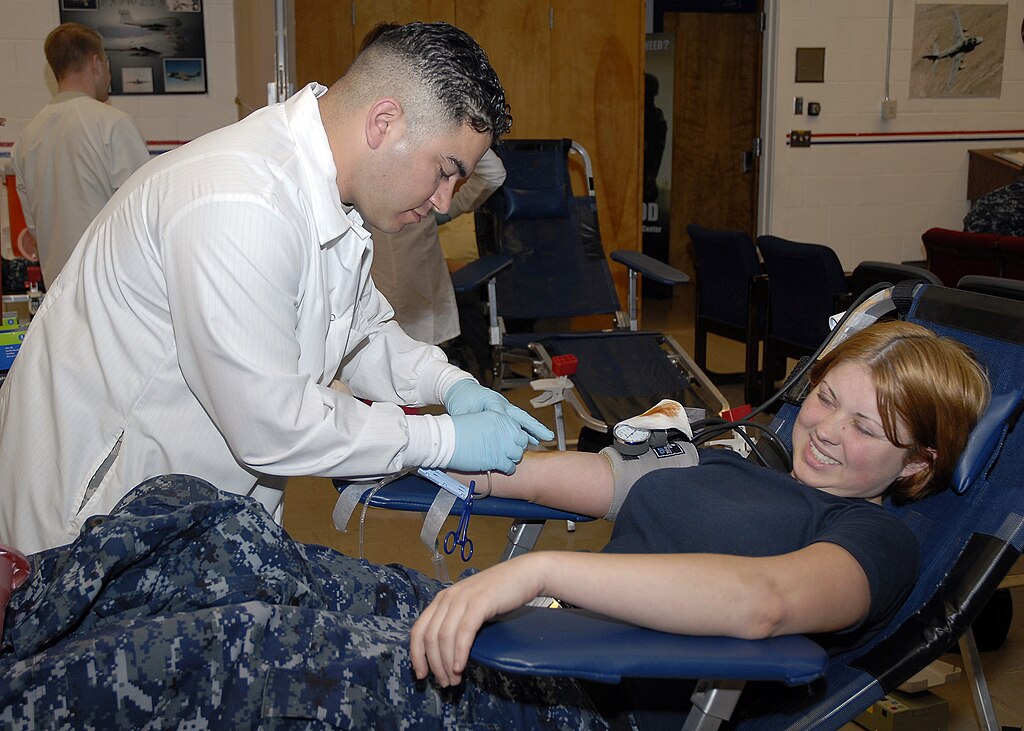 draws blood samples during a blood drive at Naval Air Station