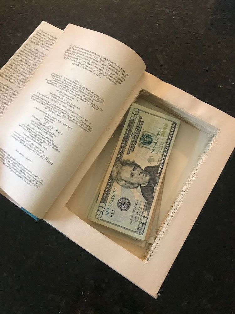 hollow book containing US dolars