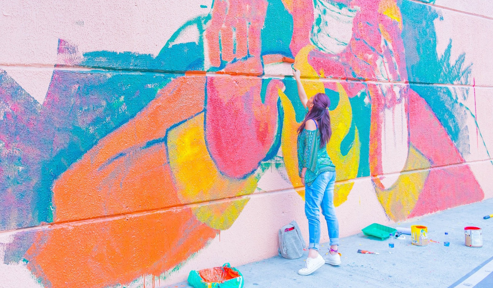 Woman painting Mural