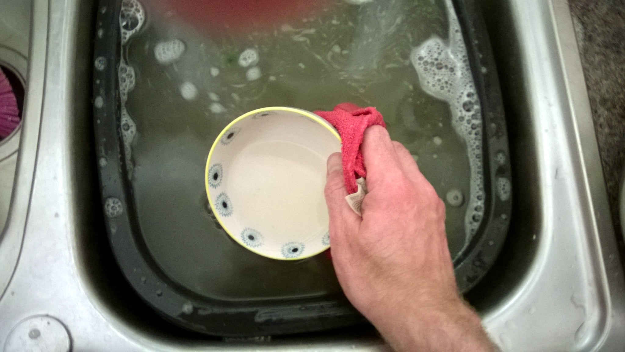 dish being hand washed